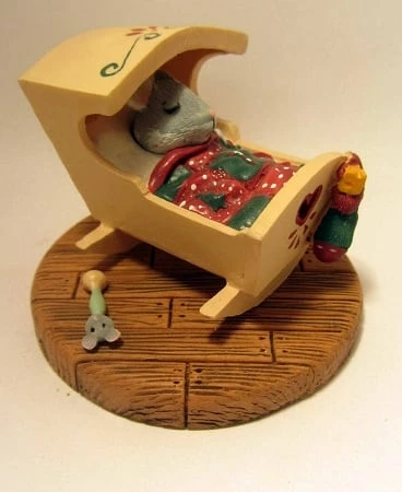Tender Touches Mouse In Cradle